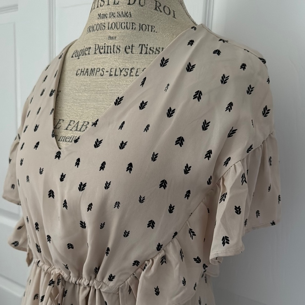 Caramela brand womens Beige dress with black pattern.